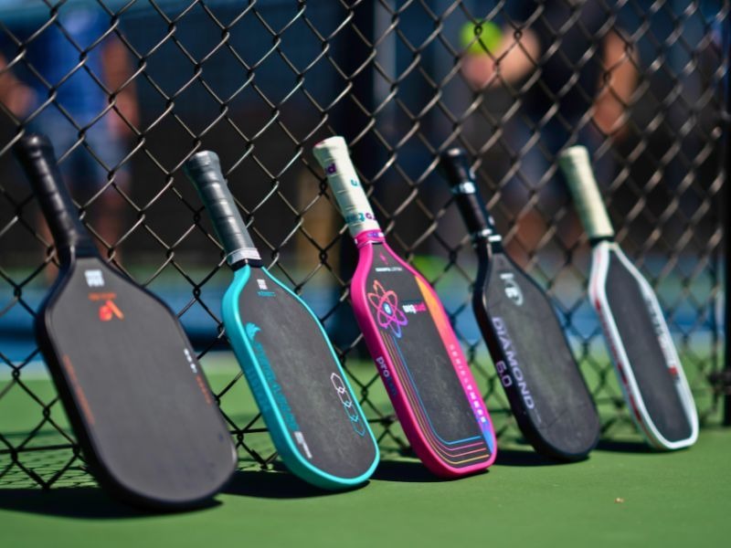 A colorful collection of pickleball paddles